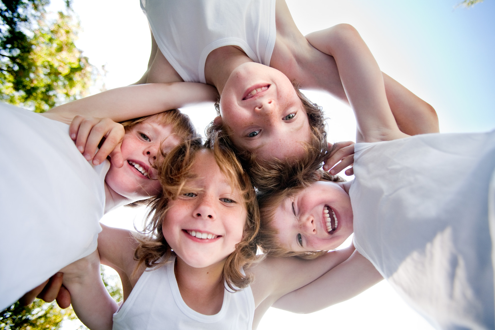 Happy children in white shirts in the sky